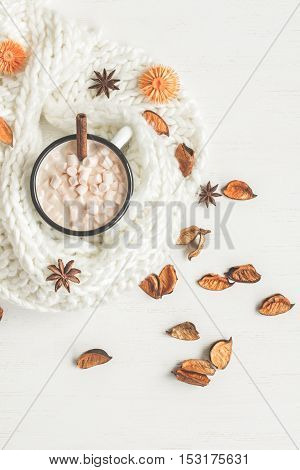 Autumn. Hot chocolate knitted blanket dried flowers and autumn leaves. Top view flat lay