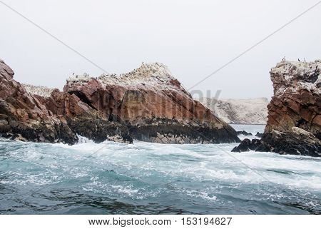 The Ballestas Islands are a group of small islands near the town of Paracas located within the Paracas District of the Pisco Province in the Ica Region on the south coast of Peru. Composed largely of rock formations and covering an estimated area of 0.12