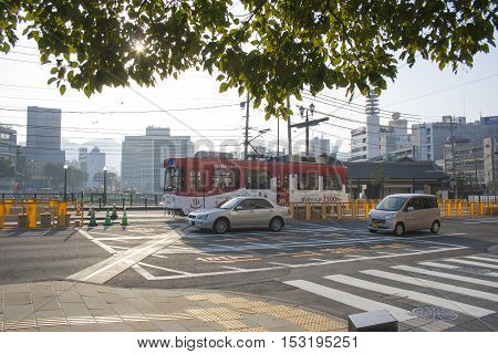 Nagasaki, Japan - February 28, 2016 Cars And Vintage Tram On The Road