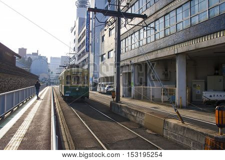 Nagasaki, Japan - February 28, 2016 Cars And Vintage Tram On The Road