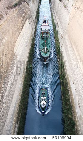 Tug conducting ship through the Corinth canal. Peloponnese. Greece
