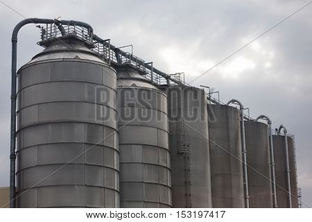 Industrial site of the chemical industry. Concrete factory or cement heavy industry manufacturing.