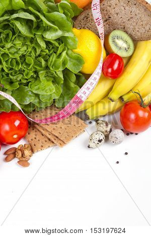 Diet weight loss breakfast concept - organic green salad pears grapefruit tomatoes. pumpkin quail eggs nuts grain bread - healthy food. vertical shot