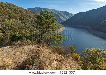 Autumn landscape of forest around Vacha (Antonivanovtsy) Reservoir, Rhodopes Mountain, Bulgaria