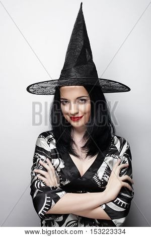 Funny Witch. Young happy woman with canival hat.