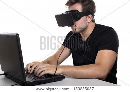 Virtual Reality gamer wearing headset tethered to a gaming pc