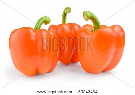 Three red sweet bulgarian peppers isolated on white background.