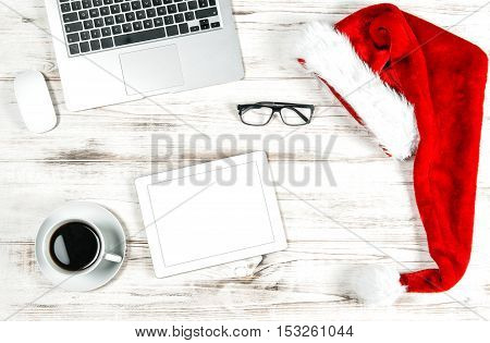 Office Workplace with Cup of Coffee and Christmas Decoration. Business Holidays Concept. Flat lay with spyce for your image or text