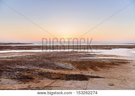 Cristal salt formation on the coast of Deas Sea Jordan at sunset.