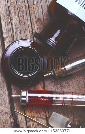 Set of retro laboratory glassware on a wood background