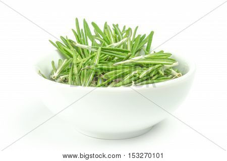 Fresh rosemary in a bowl on white background.