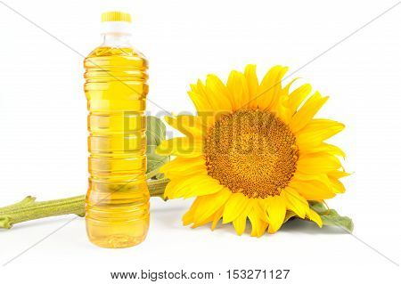 Bottle of sunflower oil with flower isolated on white background.