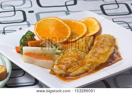 Dory fish steak with orange sauce / cooking steak concept