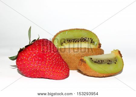 composition with strawberries and kiwi cutting on a white background