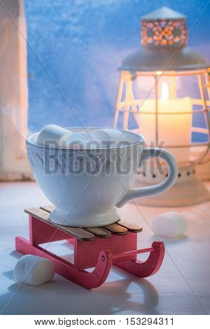Enjoy your hot chocolate with marshmallows for Christmas in cold evening