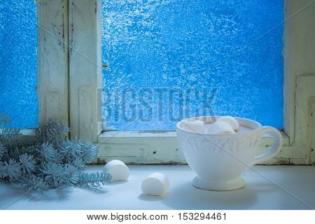 Enjoy your hot Christmas chocolate with marshmallows at cold night
