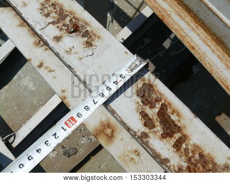 measurement of the dimensions of metal structures on the roof.