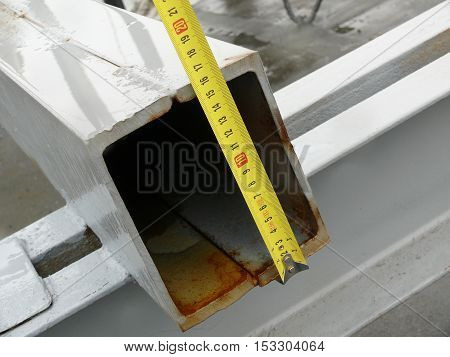 measurement of the dimensions of metal structures on the roof.