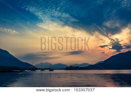 Beautiful Sunset Over The Boats On Lake In Scotland