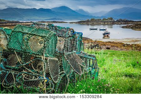 Cage For Lobster And Bay With Boats In Scotland