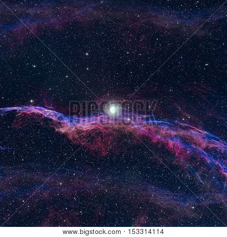 The Veil Nebula or The Witch's Broom Nebula is a cloud of heated and ionized gas and dust in the constellation Cygnus. Elements of this image furnished by NASA.