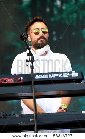 NEWPORT, ISLE OF WIGHT, UK - SEPTEMBER 11 2016: Keyboardist Kyle Simmons performing on stage with Bastille at Bestival festival on the Isle of Wight