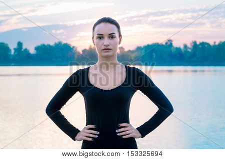 Young Woman Portrait In Early Morning During Sunrise