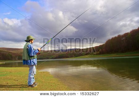 A fisherman fishing on a lake in Macedonia