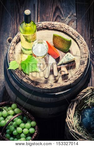 Tasty White Wine With Cheese, Grapes And Demijohn