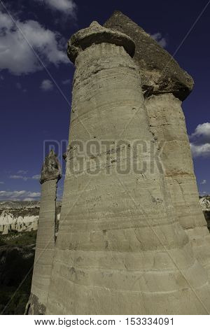 Volcanic tall rock formations in front of sky in Turkey
