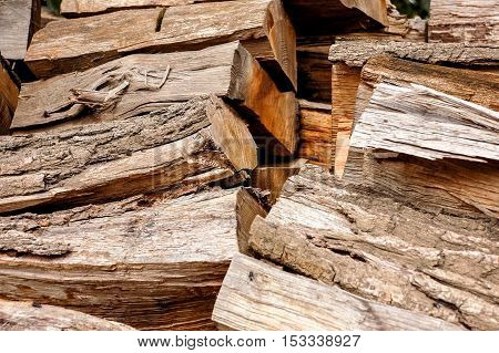 woodpile, logs for firewood texture background in autumn, ready for winter