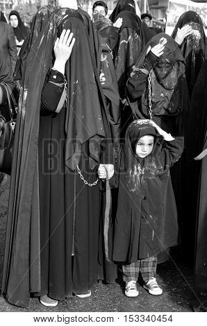 Istanbul Turkey - October 11 2016: Turkish Shia women takes part in an Ashura parade in Istanbul's district of Kucukcekmece. Turkish Shia Muslims mourning for Imam Hussain. Caferis take part in a mourning procession marking the day of Ashura in Istanbul's