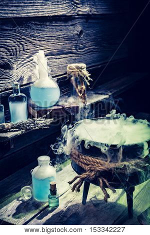 Mysterious Witcher Cauldron With Blue Smoke And Potions For Halloween