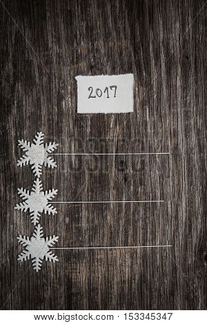 New Year's Resolutions On A Blank List On Wooden Background