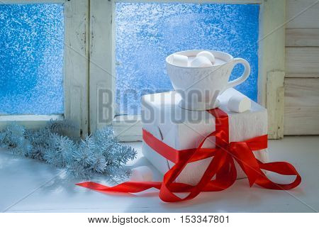 Tasty Christmas chocolate with marshmallows on old white table