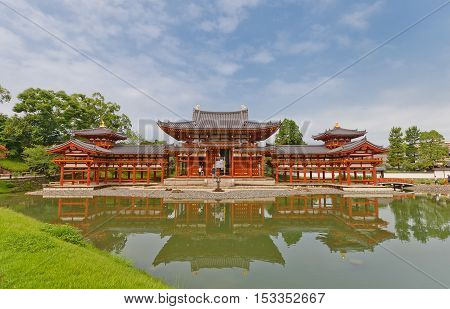 UJI JAPAN - JULY 27 2016: Phoenix Hall (Hoodo circa 1053) of Byodo-in Temple in Uji city near Kyoto. National Treasure of Japan and UNESCO site