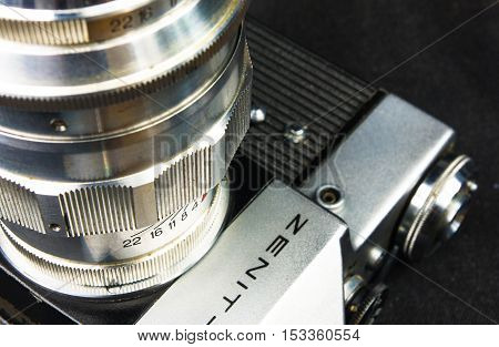 DONETSK, UKRAINE - May 07, 2016: old soviet film SLR camera Zenit - B with lens Jupiter-11, for use with 35 mm film, made in USSR in 1968 - 1973, manufactured by KMZ, with original leather case