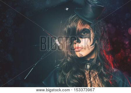Fashion girls celebrating Halloween. Haloween costumes. Masquerade party. Holiday at October 31, 2016