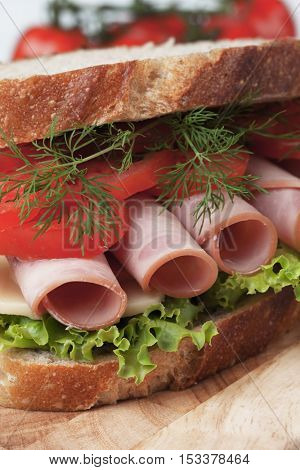 Baloney or Bologna sandwich with tomato and lettuce