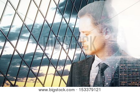 Sad pensive businessman behind iron wire mesh on sky background. Freedom concept