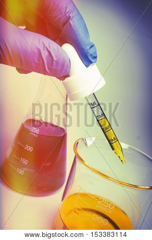 Close up glass measuring beaker for science experiment background