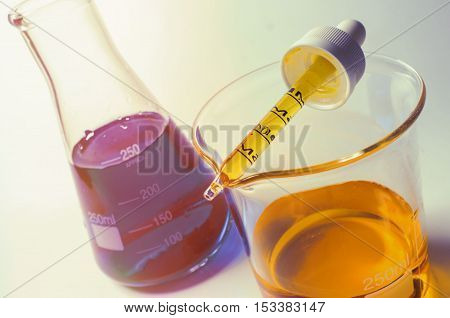 Close up glass measuring beaker for science experiment background