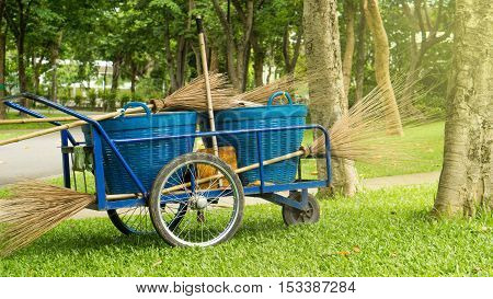 Cleaning service and green park concept - Park with handcart cleaning in cleaning service process
