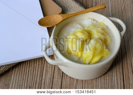 Durian, Thai Dessert Thai Cuisine Sticky Rice with Durian on Wood Background and White Paper Famous Thai Dessert