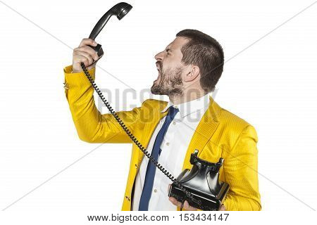 Angry Businessman Screaming To The Telephone Handset