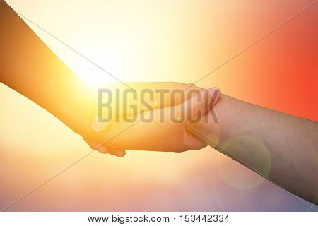Closeup hands Used to help each other on background. The concept of Business. hands strong who have experience to help the people who are able to move on to greatness.two hold love team work office.