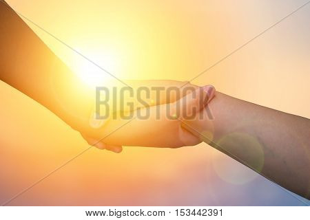 Closeup hands Used to help each other on background. The concept of Business. hands strong who have experience to help the people who are able to move on to greatness.two hold love team work office.