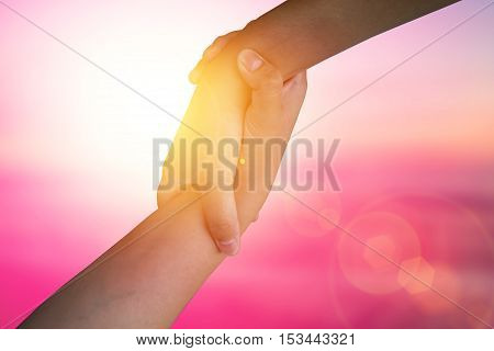 Closeup hands Used to help each other on background. The concept of Business. hands strong who have experience to help the people who are able to move on to greatness.two hold love team work office.