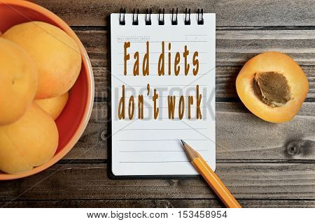 Fad diets don't work words on notepad