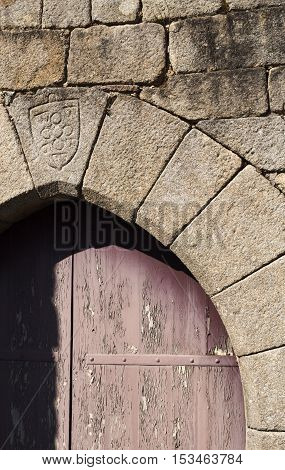 Detail on top of a lateral door of the Castle of Lindoso Portugal